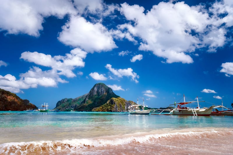 El Nido beach boats and Cadlao Island, Palawan