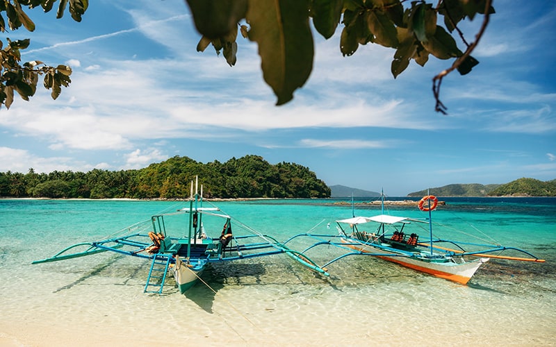 Small Bangka Boats On Beach Of Paradise Island, Port Barton, Phi